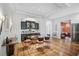 Formal dining room with hardwood floors, glass table, and built-in cabinetry at 293 Turquoise Ln, Osprey, FL 34229