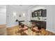 Formal dining room with hardwood floors, glass table, and built-in cabinetry at 293 Turquoise Ln, Osprey, FL 34229