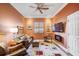 Cozy Gathering room with leather furniture and a built-in electric fireplace at 293 Turquoise Ln, Osprey, FL 34229