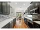 Eat-in kitchen boasts dark cabinetry, stainless steel appliances, and a breakfast nook at 293 Turquoise Ln, Osprey, FL 34229