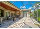 Extended covered patio with a screened enclosure, comfortable seating and access to the interior at 293 Turquoise Ln, Osprey, FL 34229