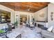 Relaxing covered patio with comfortable seating and access to interior at 293 Turquoise Ln, Osprey, FL 34229