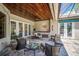 Large covered patio with seating area and access to the interior at 293 Turquoise Ln, Osprey, FL 34229