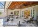 Spacious covered patio with comfortable seating and access to interior at 293 Turquoise Ln, Osprey, FL 34229