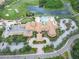 Community clubhouse and golf course with pool and parking at 322 Siena Vista Pl, Sun City Center, FL 33573
