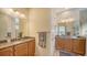 Bathroom with granite countertops and a double vanity at 322 Siena Vista Pl, Sun City Center, FL 33573