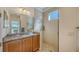 Bathroom with a walk-in shower and granite vanity at 322 Siena Vista Pl, Sun City Center, FL 33573