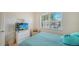 Bedroom with a full bed, TV, and ample natural light at 322 Siena Vista Pl, Sun City Center, FL 33573