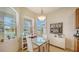 Bright breakfast nook features built-in shelving and a table for two at 322 Siena Vista Pl, Sun City Center, FL 33573