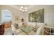 Bright dining area with a glass table and white chairs at 322 Siena Vista Pl, Sun City Center, FL 33573