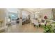 Bright dining area with a glass table and white chairs at 322 Siena Vista Pl, Sun City Center, FL 33573