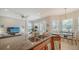 Open concept kitchen with granite island and breakfast bar at 322 Siena Vista Pl, Sun City Center, FL 33573