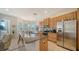 Modern kitchen with granite countertops and stainless steel appliances at 322 Siena Vista Pl, Sun City Center, FL 33573