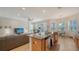 Open concept kitchen with granite island and breakfast nook at 322 Siena Vista Pl, Sun City Center, FL 33573