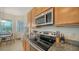 Kitchen with granite countertops and stainless steel appliances at 322 Siena Vista Pl, Sun City Center, FL 33573