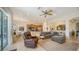 Open living space with gray sectional sofa and fan at 322 Siena Vista Pl, Sun City Center, FL 33573