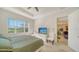 Main bedroom with king-size bed and access to additional sitting area at 322 Siena Vista Pl, Sun City Center, FL 33573