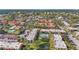 Wide aerial view of condo community, pool, tennis court at 3267 Beneva Rd # 201, Sarasota, FL 34232