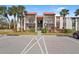 Two-story condo building with balconies and parking at 3267 Beneva Rd # 201, Sarasota, FL 34232