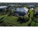 Aerial view of a house with a screened patio and landscaped yard at 4779 Pastel Ct, Sarasota, FL 34240