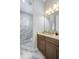 Modern bathroom with a marble shower and double vanity at 4779 Pastel Ct, Sarasota, FL 34240