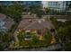 Luxury home with pool and tiki hut, aerial view at 4817 Ocean Blvd, Sarasota, FL 34242