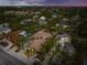 Aerial view of house and neighborhood at sunset at 4817 Ocean Blvd, Sarasota, FL 34242