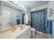 Clean bathroom with shower/tub combo and updated vanity at 4817 Ocean Blvd, Sarasota, FL 34242