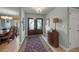 Elegant entryway with double doors and hardwood floors at 4817 Ocean Blvd, Sarasota, FL 34242