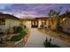 Inviting home exterior featuring a landscaped walkway leading to the entrance at sunset at 4817 Ocean Blvd, Sarasota, FL 34242