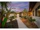 Landscaped entry with pathway to front door at 4817 Ocean Blvd, Sarasota, FL 34242