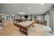 Game room showcasing a pool table and access to the kitchen at 4817 Ocean Blvd, Sarasota, FL 34242