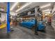 Garage with a four-post lift and room for multiple vehicles at 4817 Ocean Blvd, Sarasota, FL 34242