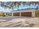 Two-car garage with wood-like panel doors at 4817 Ocean Blvd, Sarasota, FL 34242