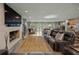 Gathering room featuring a fireplace, large TV, and comfortable seating at 4817 Ocean Blvd, Sarasota, FL 34242