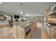 Open concept kitchen features a large granite island and stainless steel appliances at 4817 Ocean Blvd, Sarasota, FL 34242