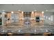 Granite countertop kitchen island with seating and modern stainless steel appliances at 4817 Ocean Blvd, Sarasota, FL 34242