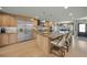 Modern kitchen features stainless steel refrigerator, granite countertops, and custom cabinetry at 4817 Ocean Blvd, Sarasota, FL 34242