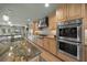 Modern kitchen with stainless steel double ovens and granite countertops at 4817 Ocean Blvd, Sarasota, FL 34242