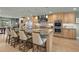 Eat-in kitchen with granite island, stainless steel appliances, and light wood cabinets at 4817 Ocean Blvd, Sarasota, FL 34242