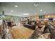 Open floor plan boasting a modern kitchen and Gathering room with leather furniture at 4817 Ocean Blvd, Sarasota, FL 34242