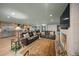 Living room with fireplace, leather sofas, and large screen TV at 4817 Ocean Blvd, Sarasota, FL 34242