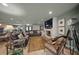 Spacious living room with fireplace, comfortable seating, and large TV at 4817 Ocean Blvd, Sarasota, FL 34242