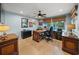 Home office with built-in desk and hardwood floors at 4817 Ocean Blvd, Sarasota, FL 34242