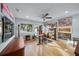 Home office with glass desk and hardwood floors at 4817 Ocean Blvd, Sarasota, FL 34242