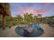 Kidney shaped pool with swim up lounge chairs and a peaceful water view at 4817 Ocean Blvd, Sarasota, FL 34242