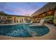 Inviting pool area with lounge chairs and tiki hut offering relaxing sunset views at 4817 Ocean Blvd, Sarasota, FL 34242