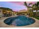 Stunning kidney-shaped pool with a tranquil ambiance and outdoor dining area at 4817 Ocean Blvd, Sarasota, FL 34242