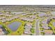Aerial view of houses,ponds and roads in a community at 5107 Coral Reef Way, Bradenton, FL 34211