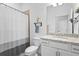 Clean bathroom with shower/tub combo, white vanity, and granite countertop at 5107 Coral Reef Way, Bradenton, FL 34211